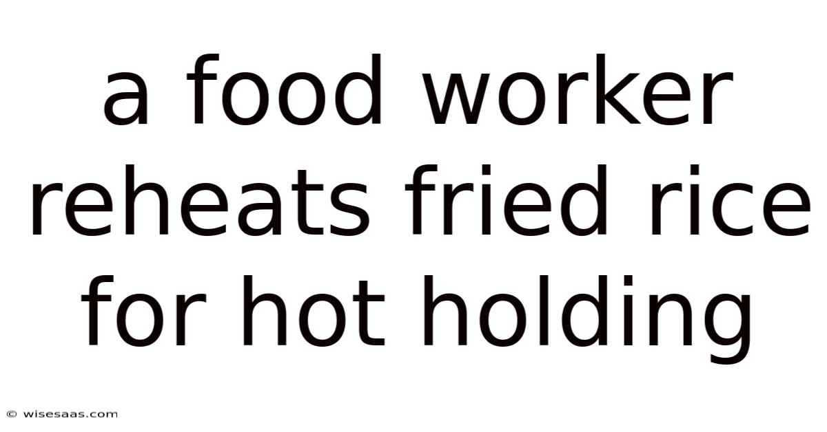A Food Worker Reheats Fried Rice For Hot Holding